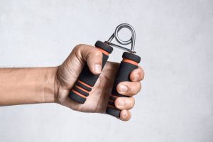 Hand,Of,Southeast,Asian,,Chinese,Man,Gripping,Hand,Exercise,Gripper.